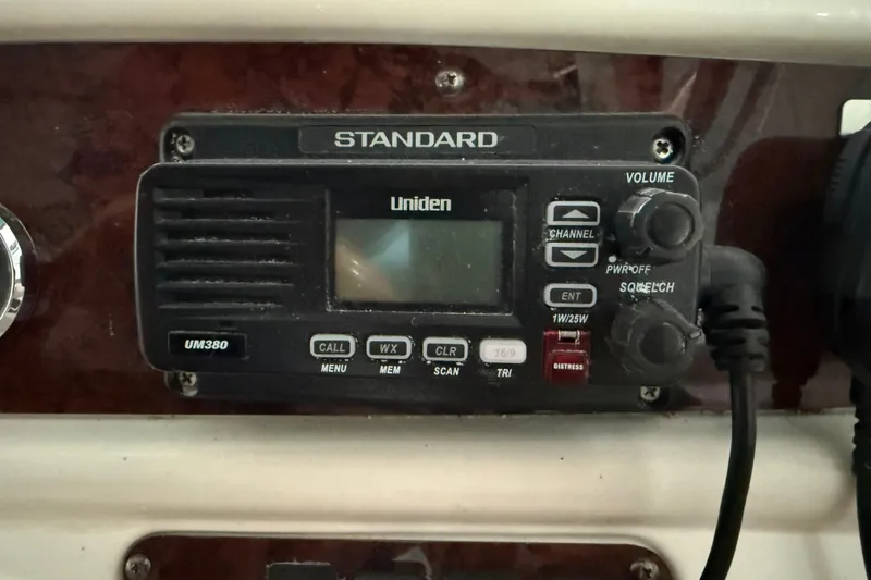 Slide: The Image of Uniden UM380 radio on 1998 Sea Ray 290 Sundancer boat dashboard. - 14