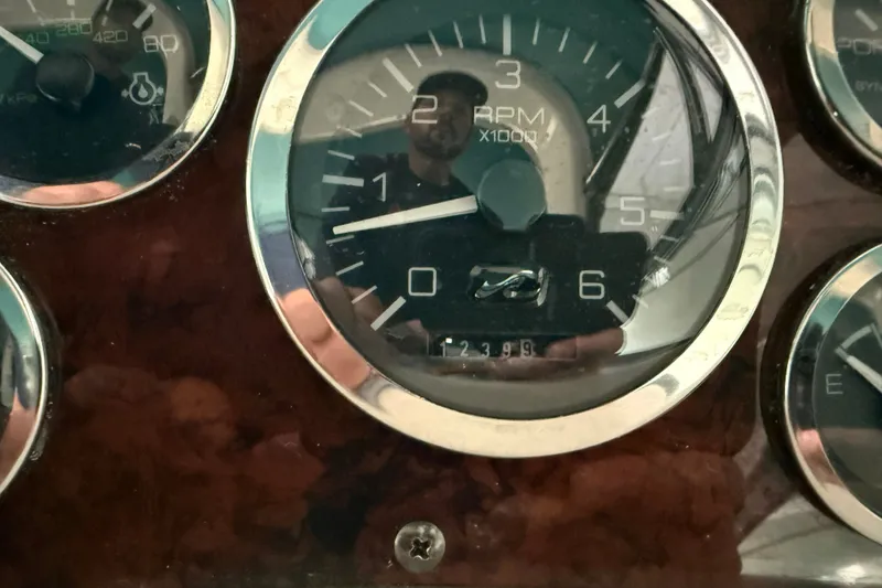 Slide: The Image of Close-up of 1998 Sea Ray 290 Sundancer RPM gauge showing 1239.9 hours. - 15