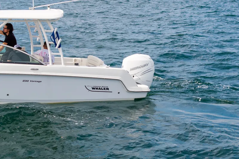 Slide: The Image of 2018 Boston Whaler 230 Vantage boat cruising on open water. - 10