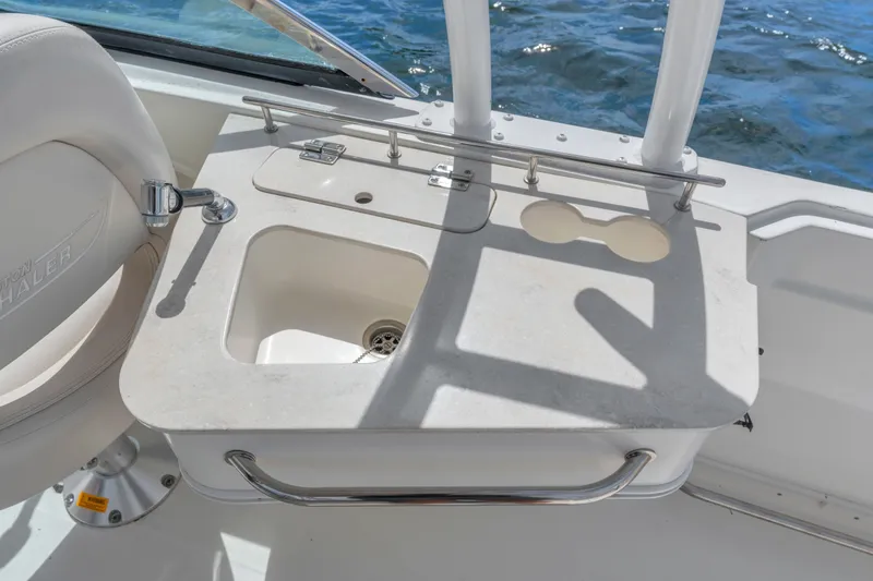 Slide: The Image of Boston Whaler 230 Vantage 2018 boat sink and counter detail with ocean backdrop. - 18