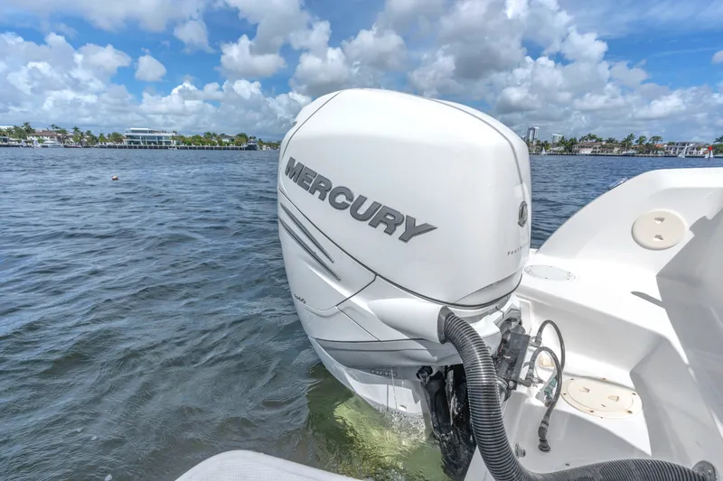 Slide: The Image of 2018 Boston Whaler 230 Vantage with Mercury outboard engine on water. - 13
