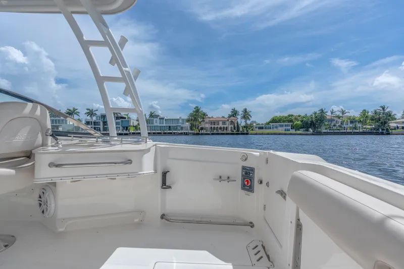 Slide: The Image of 2018 Boston Whaler 230 Vantage boat interior with waterfront view and clear blue sky. - 17
