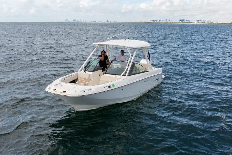 Slide: The Image of 2018 Boston Whaler 230 Vantage boat cruising on open water. - 2