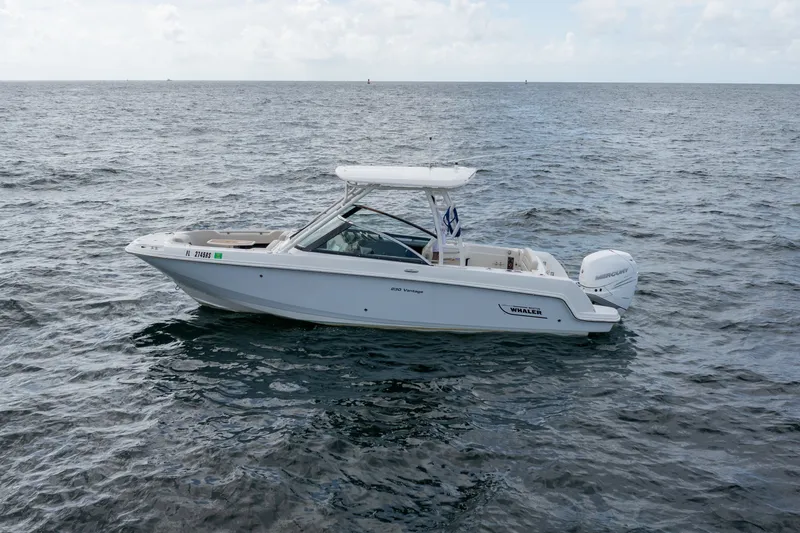 Slide: The Image of 2018 Boston Whaler 230 Vantage boat cruising on open water. - 6