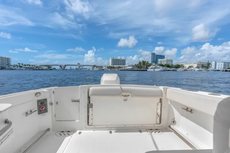 Slide: The Image of 2018 Boston Whaler 230 Vantage boat interior with scenic waterfront view. - 15