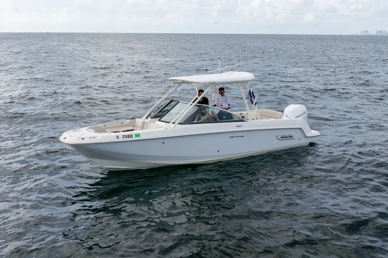 Slide: The Image of 2018 Boston Whaler 230 Vantage boat cruising on open water. - 4