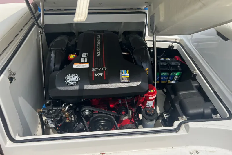 Slide: The Image of Volvo Penta 270 V8 engine in 2012 Cobalt 220 boat, open engine compartment. - 12