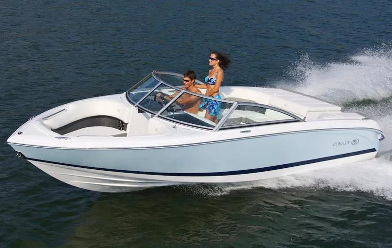 Slide: The Image of Manufacturer Provided Image: 2012 Cobalt 220 boat cruising on water with two passengers. - 20