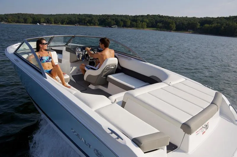 Slide: The Image of Manufacturer Provided Image: 2012 Cobalt 220 boat cruising on a lake with two passengers. - 22