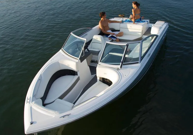 Slide: The Image of Manufacturer Provided Image: 2012 Cobalt 220 boat on water with two people relaxing onboard. - 24