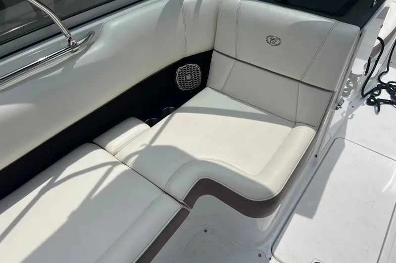 Slide: The Image of Luxurious white seating on a 2012 Cobalt 220 boat, featuring elegant design and comfort. - 16