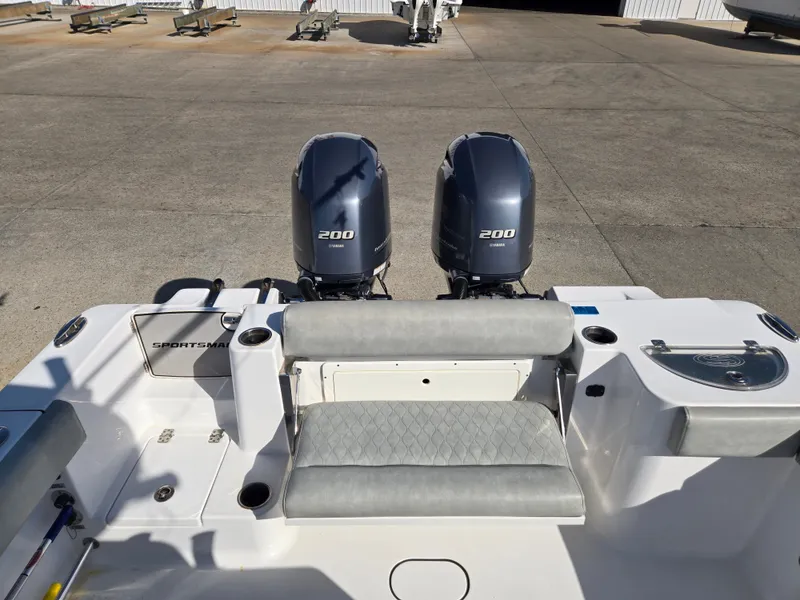 Slide: The Image of The image shows the stern of a 2020 Sportsman Open 282TE Center Console boat with twin engines. - 5