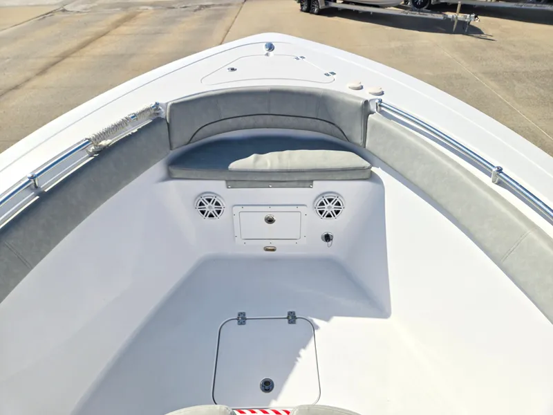 Slide: The Image of The image shows the bow of a 2020 Sportsman Open 282TE Center Console boat with gray cushions. - 14