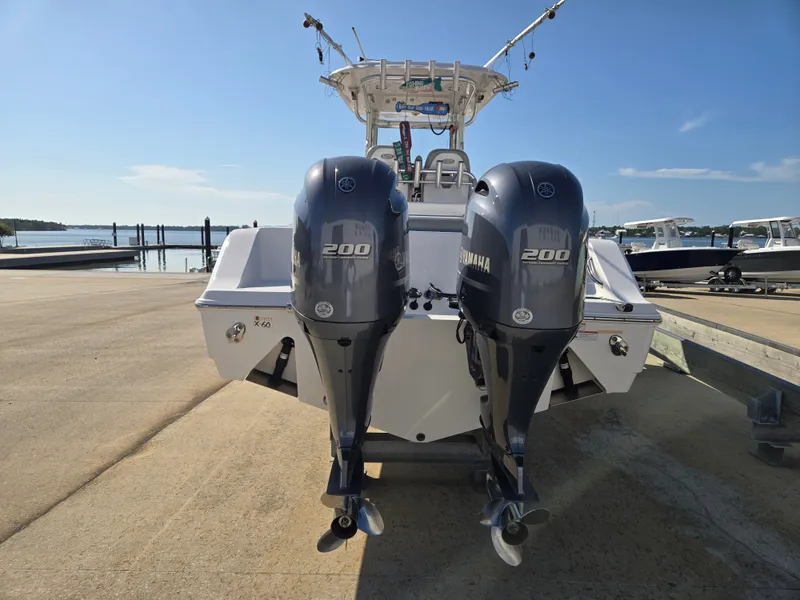 Slide: The Image of A 2020 Sportsman Open 282TE Center Console boat with twin Yamaha 200 engines. - 4