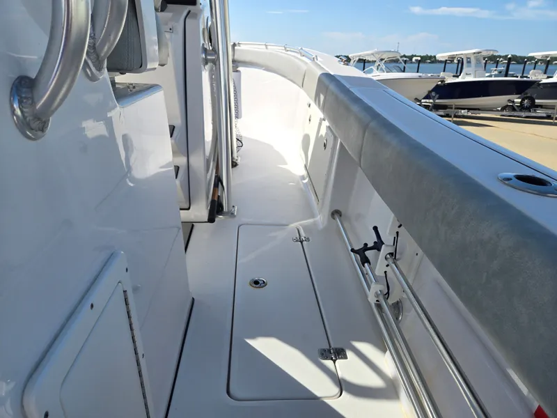 Slide: The Image of The image shows the deck of a 2020 Sportsman Open 282TE Center Console boat. - 9