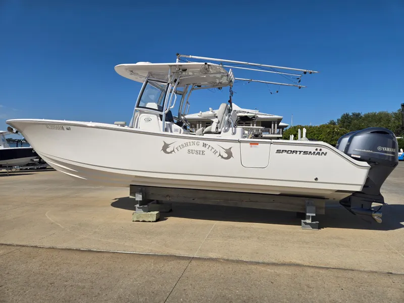 Slide: The Image of A 2020 Sportsman Open 282TE Center Console boat is on a dock. - 1