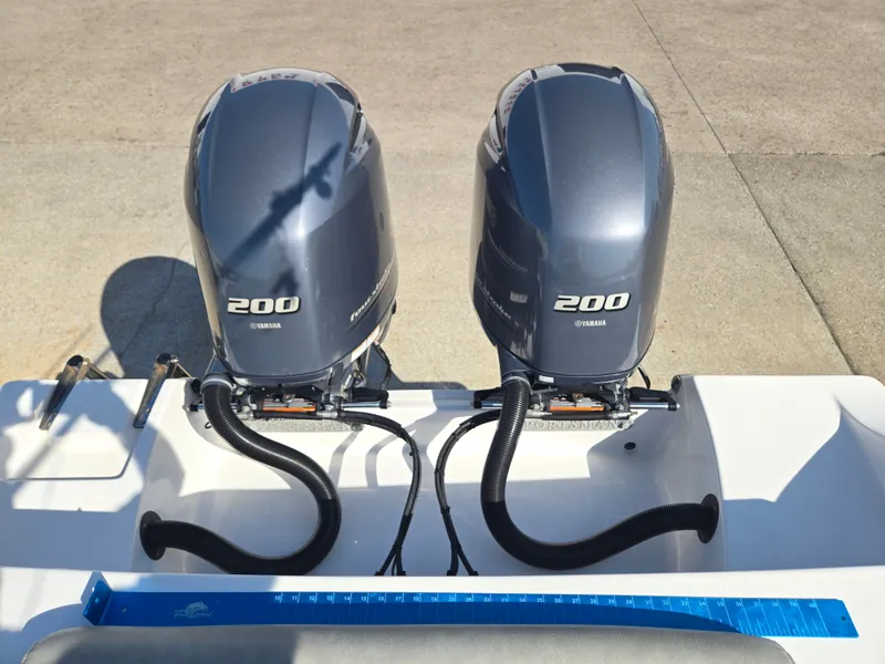 Slide: The Image of Two Yamaha 200 outboard engines are mounted on the stern of a Sportsman Open 282TE Center Console boat. - 16