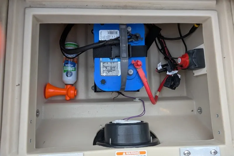 Slide: The Image of Battery compartment of 2017 Manitou 23 Aurora VP with sports horn and wiring. - 4