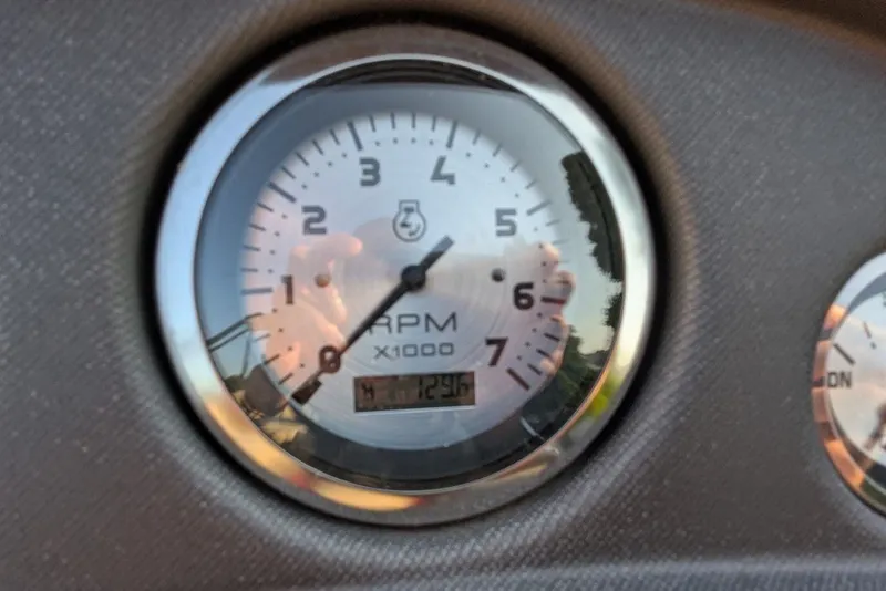 Slide: The Image of Close-up of a 2017 Manitou 23 Aurora VP tachometer displaying RPM readings. - 17
