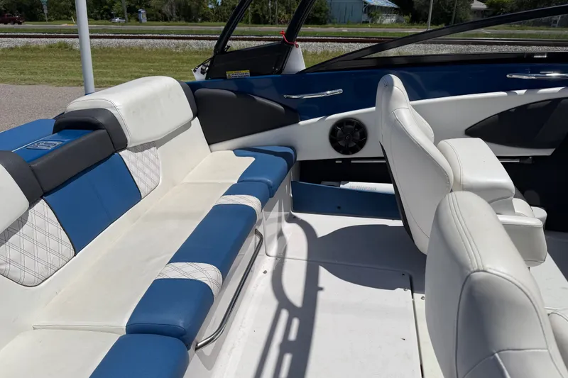 Slide: The Image of Interior of a 2018 Glastron GTS 187 boat with blue and white seating. - 3