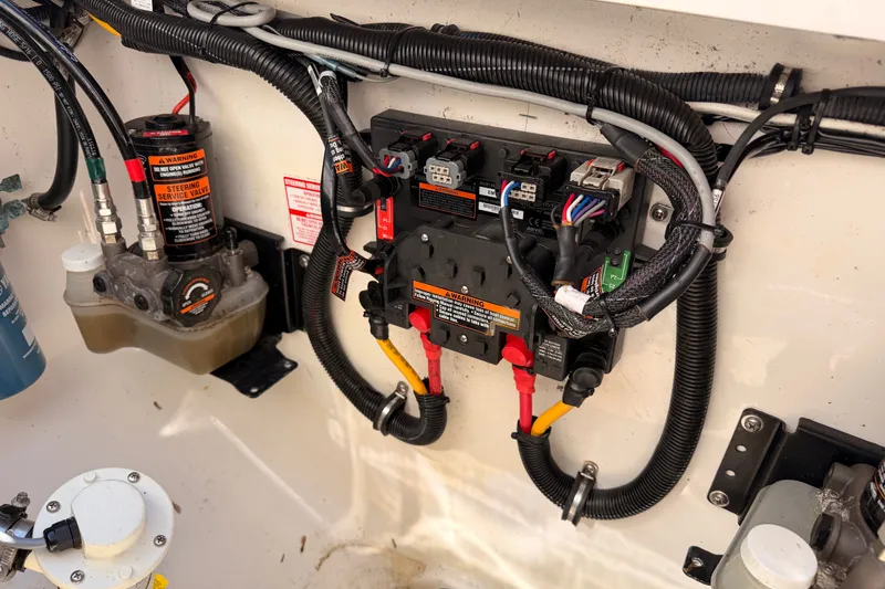 Slide: The Image of Electrical and hydraulic system of a 2016 Regulator 34 boat, featuring wiring and components. - 36