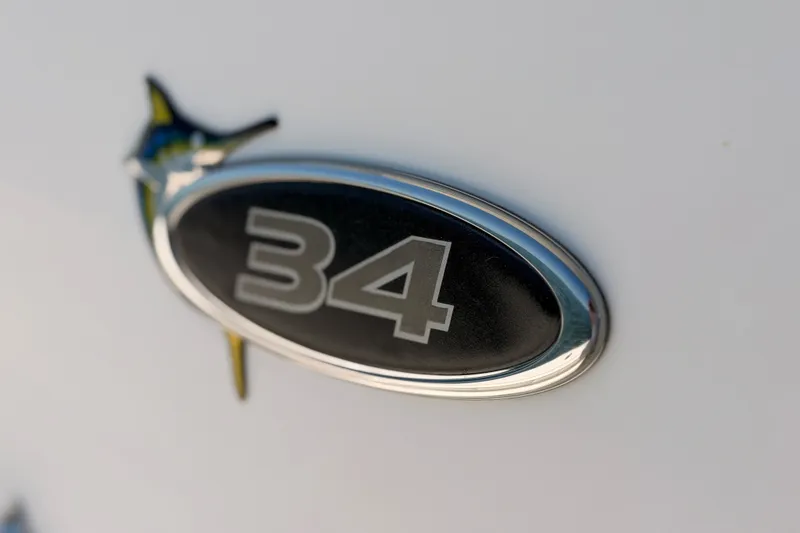 Slide: The Image of Close-up of 2016 Regulator 34 emblem with marlin design on white background. - 39