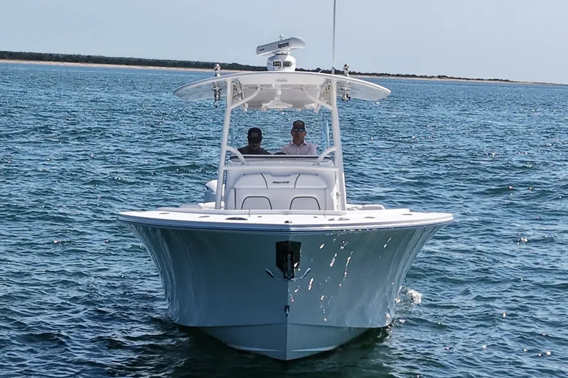 Slide: The Image of 2016 Regulator 34 on the water with two people on board. - 4