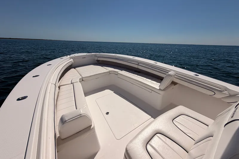 Slide: The Image of 2016 Regulator 34 boat with spacious seating on open water. - 21