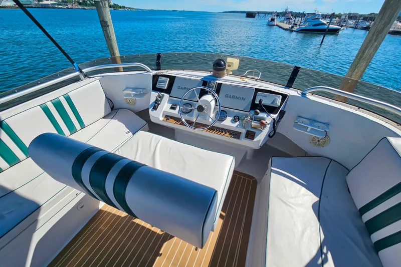 Slide: The Image of Cockpit of 2000 Mainship 39 Trawler with Garmin navigation, overlooking marina. - 28