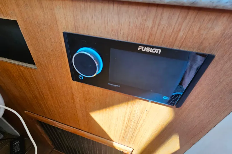 Slide: The Image of Fusion stereo system on 2000 Mainship 39 Trawler, mounted on wooden panel. - 17