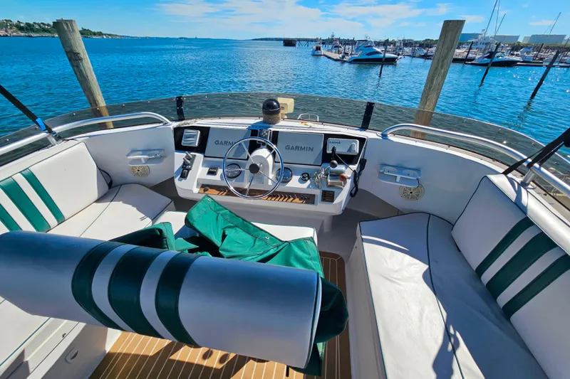 Slide: The Image of Cockpit of 2000 Mainship 39 Trawler with Garmin navigation, overlooking marina and blue waters. - 29
