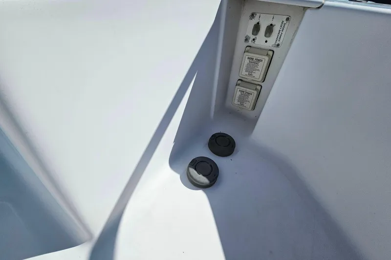 Slide: The Image of Electrical panel and outlets on 2000 Mainship 39 Trawler boat. - 12