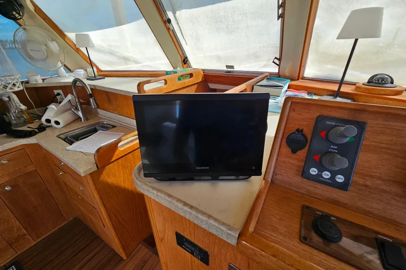 Slide: The Image of Interior of 2000 Mainship 39 Trawler with navigation equipment and control panel. - 36