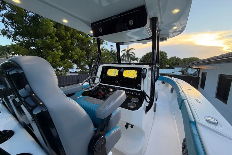 Slide: The Image of 2023 Sea Tech 33 boat cockpit with modern navigation system at sunset. - 32
