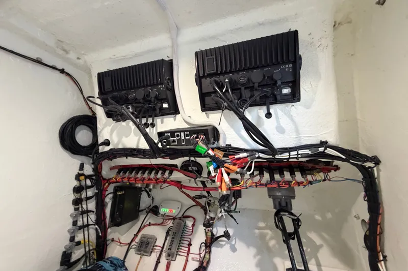 Slide: The Image of Electrical wiring and equipment setup in a Sea Tech 33, 2023 model boat. - 52