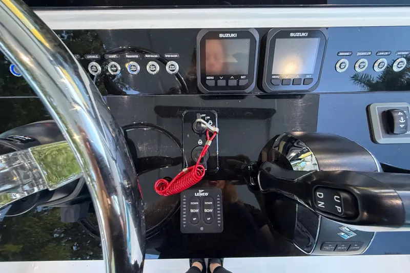 Slide: The Image of The image shows the helm of a Sea Tech 33 boat with modern instruments and controls. - 36