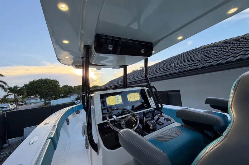 Slide: The Image of Modern Sea Tech 33 boat cockpit with advanced navigation system, 2023 model, at sunset. - 19