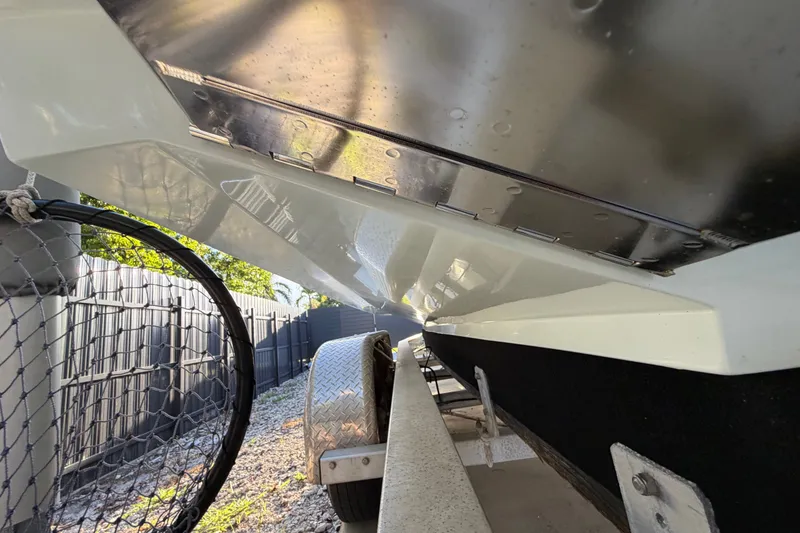 Slide: The Image of Underneath view of a 2023 Sea Tech 33 boat on a trailer. - 4