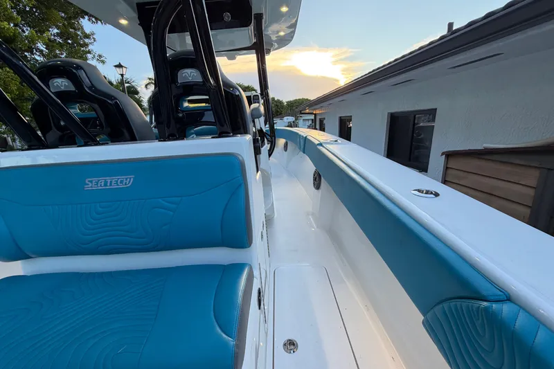 Slide: The Image of 2023 Sea Tech 33 boat interior with blue seating and sleek design. - 28