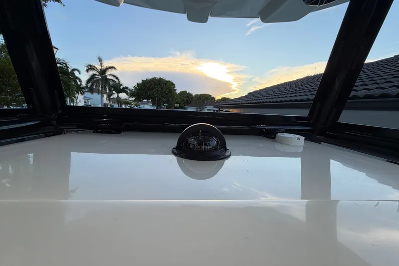 Slide: The Image of 2023 Sea Tech 33 boat deck with sunset view and palm trees. - 47