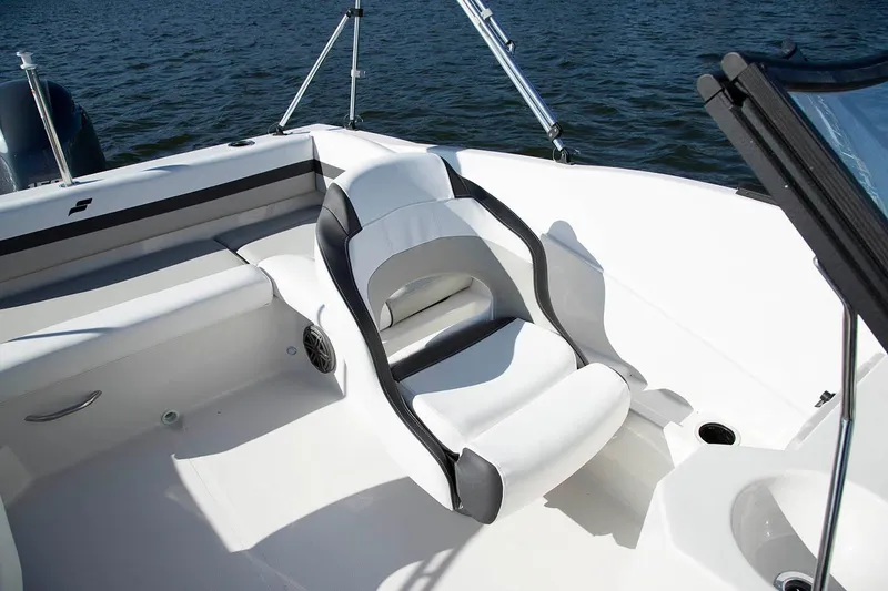 Slide: The Image of Manufacturer Provided Image: 2026 Starcraft SVX 190 DC OB boat interior with white seating and water backdrop. - 5