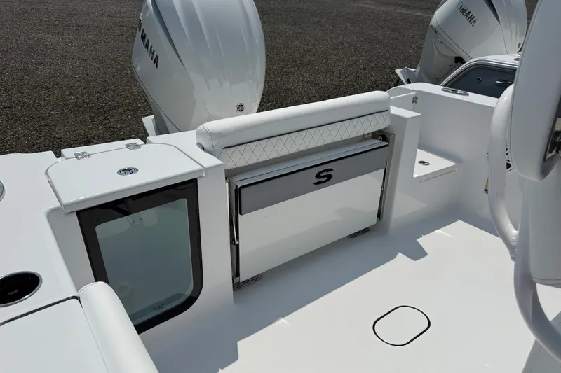 Slide: The Image of 2027 Sportsman Open 232 Center Console boat interior with Yamaha engines. - 10