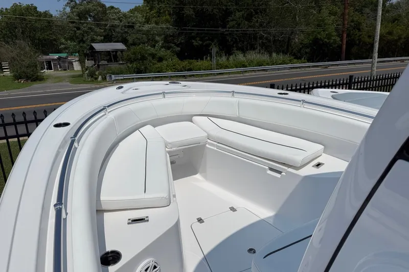 Slide: The Image of 2027 Sportsman Open 232 Center Console boat with spacious seating and sleek design. - 2