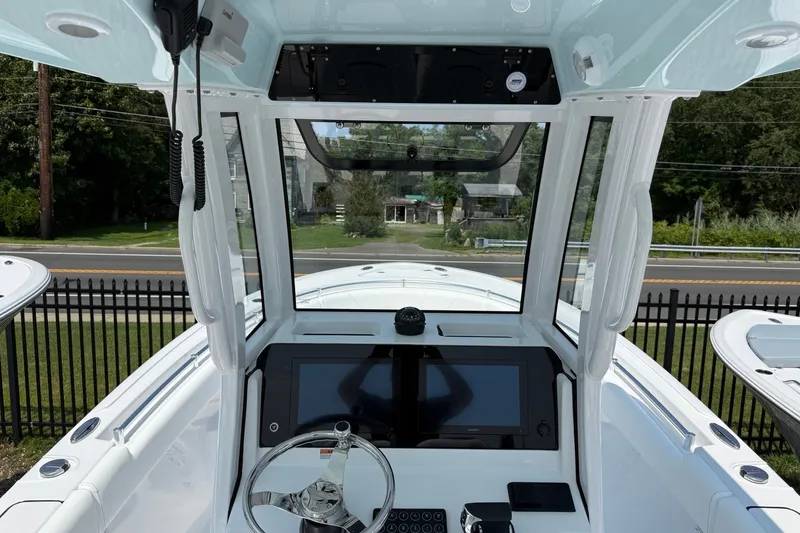 Slide: The Image of Interior view of 2027 Sportsman Open 232 Center Console boat cockpit. - 8