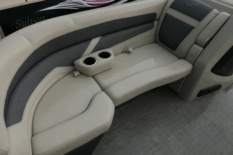 Slide: The Image of 2023 Barletta Cabrio 22UC boat interior with cushioned seating and cup holders. - 5
