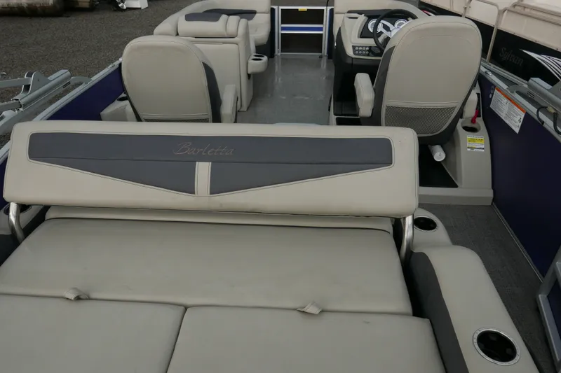 Slide: The Image of 2023 Barletta Cabrio 22UC pontoon boat interior with seating and steering console. - 13
