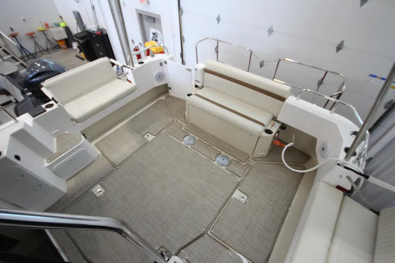 Slide: The Image of 2026 Ranger Tugs R-31 CB boat interior with spacious seating and modern design. - 13