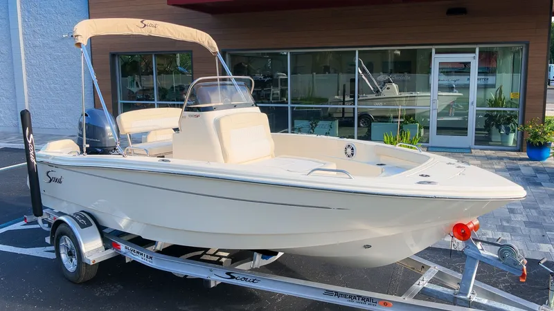 The Image of Scout 188 Sportfish 2027 on a trailer in front of a building. - 1