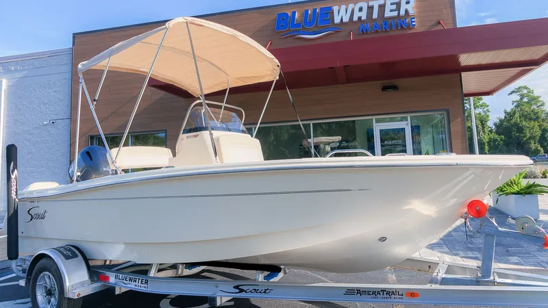 The Image of Scout 188 Sportfish 2027 on a trailer in front of a building with Bluewater Marine logo. - 1