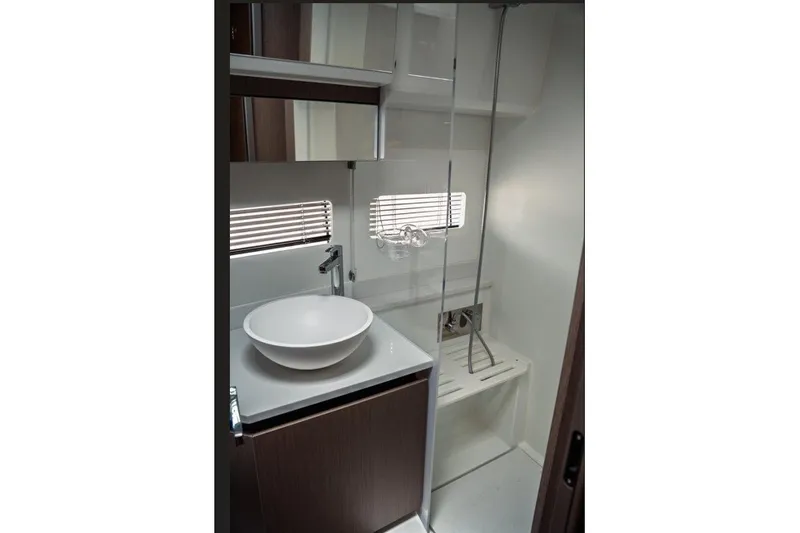 Slide: The Image of Modern bathroom interior of 2025 Jeanneau NC 1295 Coupe yacht, featuring sleek design and fixtures. - 39